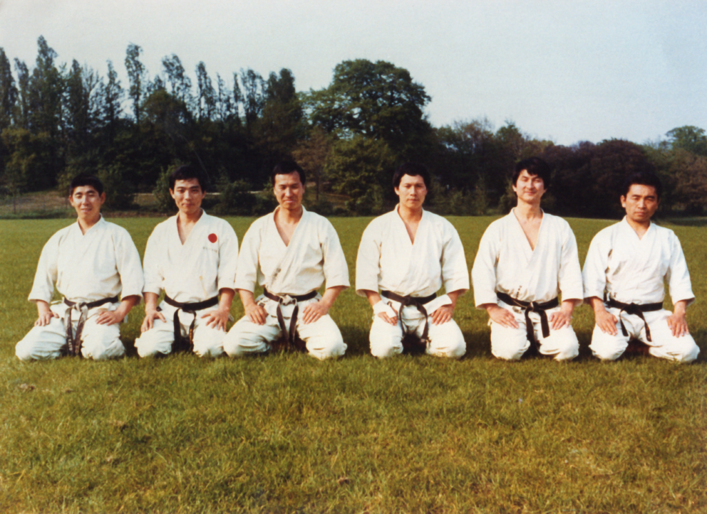 JKA course at Crystal Palace from left to right:
Sensei S. Kato, Sensei S. Miyazaki, Sensei K. Eneoda , Sensei H. Shirai, Sensei S. Asano, Sensei Y. Sumi